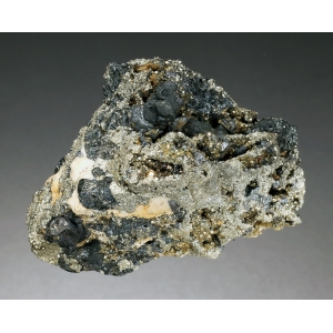 Черные кристаллы станнина до 0,8 см в матриксе. Боливия